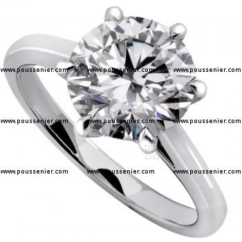 solitaire ring with a brilliant cut diamond on a thinner band with palmets