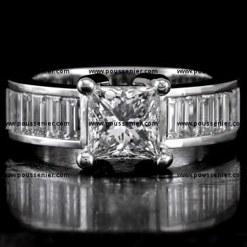 solitaire ring with a central princess cut diamond and channel set baguettes on the side