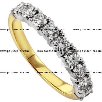 wedding ring set with brilliant cut diamonds with four prongs per diamond