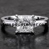 handmade ring with a princess cut diamond flanked by two tapers mounted on a finer band