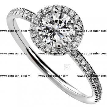 halo ring with a central brilliant cut diamond on a fine round band set with smaller diamonds