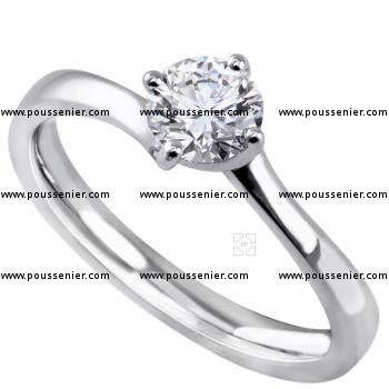 solitaire ring with a brilliant cut diamond in a twisted setting with four prongs