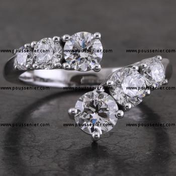 double trilogy ring with brilliant cut diamonds set in prongs