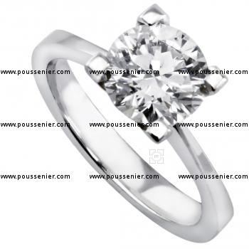solitaire ring with a brilliant cut diamond set in four slimmer prongs on a smaller band