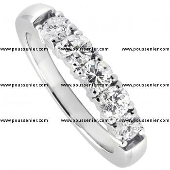 wedding ring with brilliant cut diamonds set with four prongs per diamond