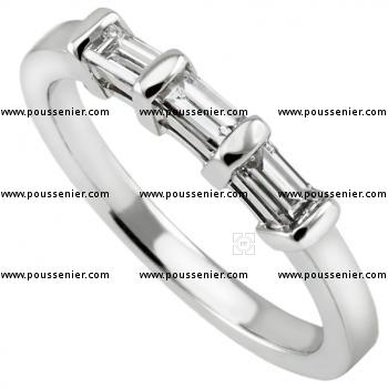 wedding ring hand made and set with three baguettes with bars or open boxes on the side