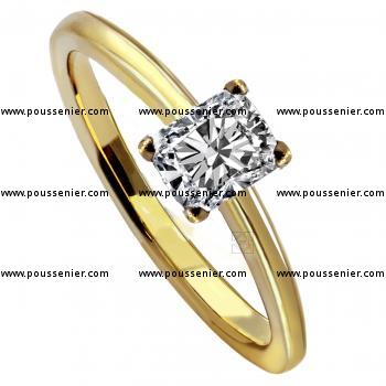solitairering with a radiant cut diamond set with four claws on a slim lower band