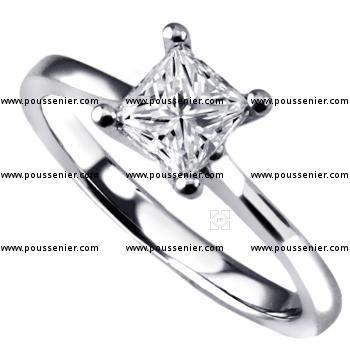 solitairering with a princess cut diamond set in four prongs on a shank with small palmets