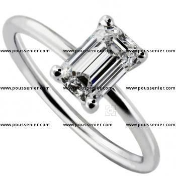 solitairering with an emerald cut diamond set in four prongs on a round band