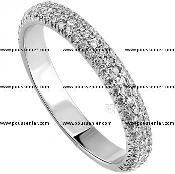 Rounded pavée ring set with three rows of brilliant cut diamonds in castle setting set completely all around