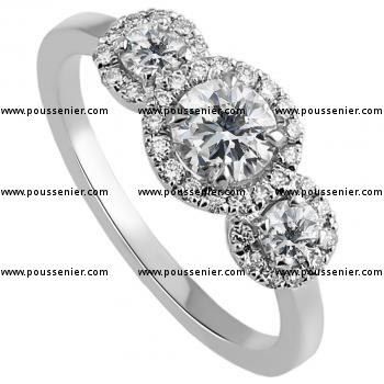 entourage trilogy ring with three central diamonds surrounded with brilliant cut diamonds