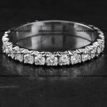 wedding band set with brilliant cut diamonds completely castle set with fishtail finish