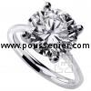 handmade solitaire ring with a brilliant cut diamond set four prongs with inbetween a roundel
