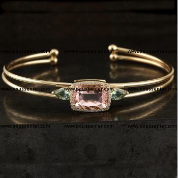 entourage bracelet with a Morganite / Beryl faceted antique cut surrounded by small brilliant cut diamonds and flanked by a pear-cut hell tourmaline mounted on two hollow tube bangles