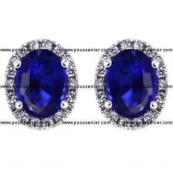 halo earrings with central oval cut heat treated sapphires surrounded by brilliant cut diamonds