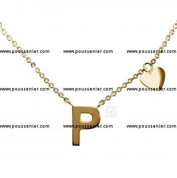 fine rolo necklace with a letter sawed by hand and flanked by a small heart