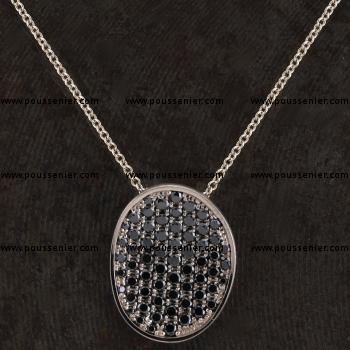 pavé pendant with a concave asymmetric disc or bowl with pavé set black brilliant cut diamonds