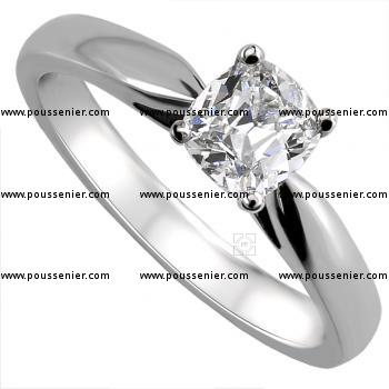 solitaire ring with a cushion cut diamond set in 4-prong setting between a band or shank and palmets on the side
