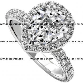 halo ring with a central pear cut diamond with tiny diamonds and the band castle set on top and on the side