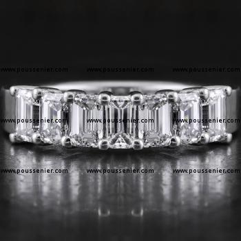 alliance ring with seven emerald cut diamonds set with two prongs between each two diamonds