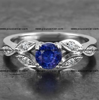 handmade soltaire ring with a brilliant cut sapphire along which small marquise shaped leaves decorated with diamonds