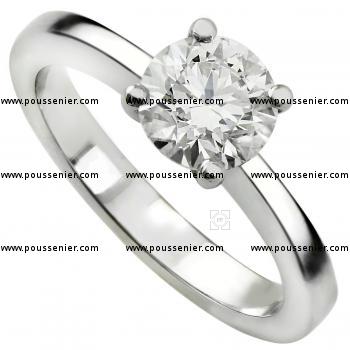 Handmade solitaire ring with a brilliant cut diamond set into four prongs in a conical basket