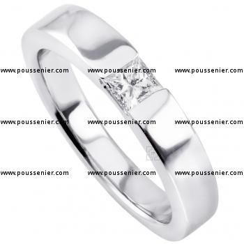 slim solitaire ring with a princess cut diamond under which a small join