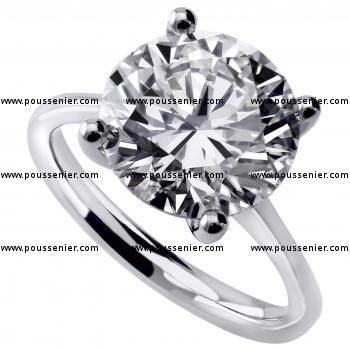handmade solitaire ring with a brilliant cut diamond set four prongs with inbetween a roundel