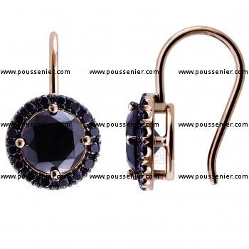 halo earrings with a central larger black diamond accented by smaller castle set around pending on a hook system