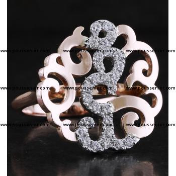 ring with arabesque motif pavé set with brilliant cut diamonds mounted on a D-profile band with palmettes