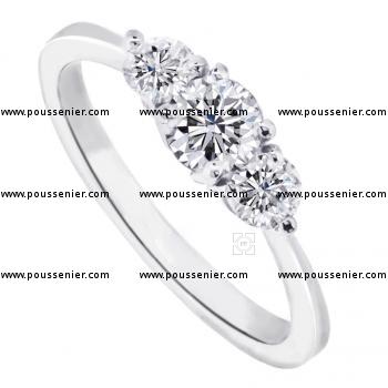 trilogy ring with three brilliant cut diamonds set wtith 3 prongs for the stones on the side