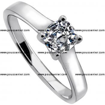 solitaire ring with a cushion cut diamond set in 4 crossed prongs