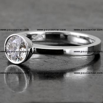 handmade solitaire ring with a brilliant cut diamond bezel set in a cup