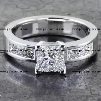 solitaire ring with a central princess cut diamond and channel set princess cut diamonds on the side