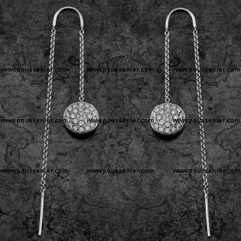 pavé earrings with a round disc pavé set with brilliant cut diamonds mounted on an arch chain system with pin