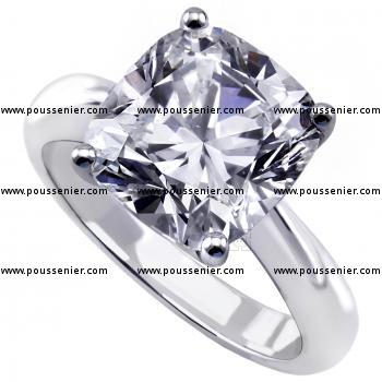 solitaire ring with a cushion cut diamond set with four claws