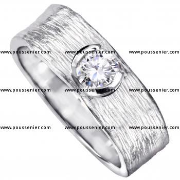 solitaire ring with a brilliant cut diamond in a semi-open pot with a thin edge on an organic finished band