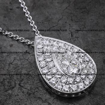 halo pear shaped pendant with three larger brilliant cut diamonds in the centre surrounded with pavé set smaller diamonds