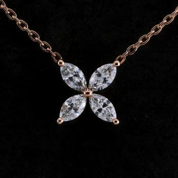 Necklace featuring a crossleaf clover design with marquise-shaped petals, adorned with marquise-cut diamonds set in prongs.