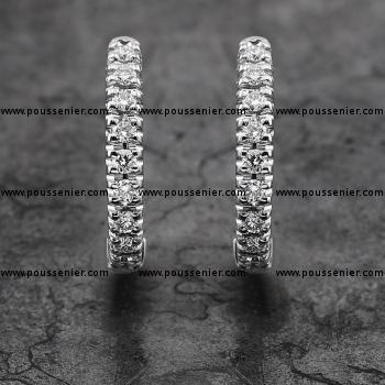 creole earrings with one row of castel set brilliant cut diamonds and clip system