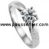 solitaire ring with a brilliant cut diamond brilliant set with four claws between a band with palmets