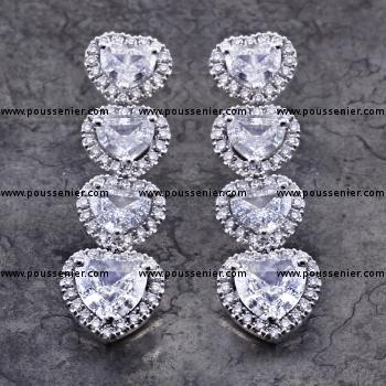 halo set earrings with heart cut diamonds surrounded with smal brilliant cut diamonds