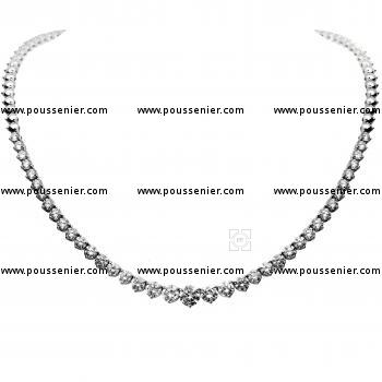 tennis necklace with descending brillliant cut diamonds set with three prong per diamond