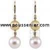 pearl earrings with brilliant cut diamonds and a yellow and white South Sea pearl on a hook