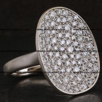pavé ring with a concave asymmetric disc or bowl with pavé set fancy brown brilliant cut diamonds mounted on a narrow band