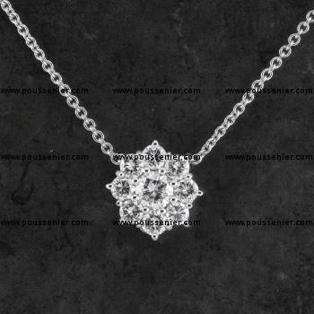 força necklace with a flower-shaped entourage pendant with a central brilliant cut diamond with eight prongs set and double brace at the back or fixed to prongs