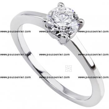 solitaire ring with a brilliant cut diamond set in four prongs on a slimmer small band