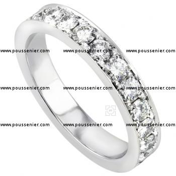 handmade wedding ring with brilliant cut diamonds slightly deeper in the band completely pavé set 4 grains by stone
