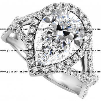 entourage ring with pear shaped surrounded by brilliant cut diamonds on a lower braided band