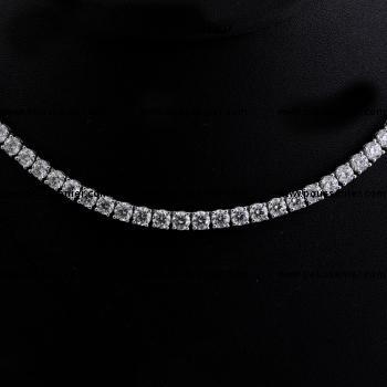 tennis necklace or rivière with brilliant cut diamonds set with four prongs or claws and not set in back of the neck